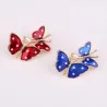 Broches double papillon de printemps