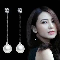 Boucles d'oreilles longues avec perle blanche