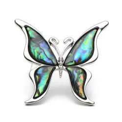 Papillon avec une coque colorée - une broche métallique