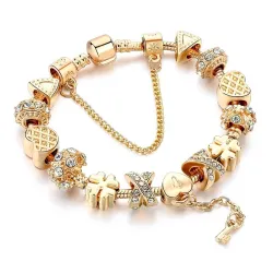 Bracelet tendance or avec breloques - coeurs - perles - trèfle - clé