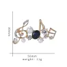 Musical notes - crystal brooch