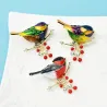 Bird sitting on branch - crystal brooch