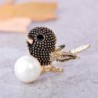 Vintage bird-shaped brooch with pearlBrooches