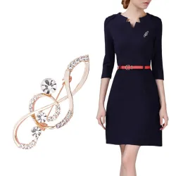 Broche en or luxueuse - avec note de musique en cristal