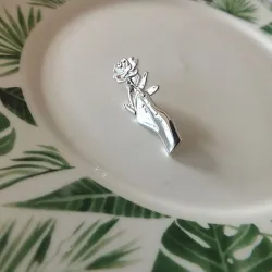 Silver brooch with a hand holding rose - pin