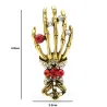 Crystal skull hand - vintage brooch