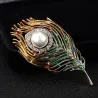 Trendy brooch with feather / pearl / crystals