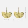 Boucles d'oreilles dorées en forme de feuilles - métal