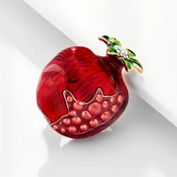 Broche élégante avec grenade rouge