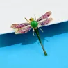 Broche libellule en cristal coloré