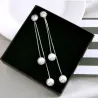 Boucles d'oreilles longues élégantes avec perles / cristal