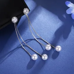 Boucles d'oreilles longues élégantes avec perles / cristal