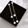 Boucles d'oreilles longues élégantes avec perles / cristal