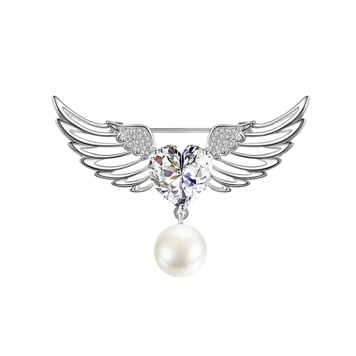 Broche luxueuse - ailes d'ange - coeur cristal - perle