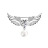 Broche luxueuse - ailes d'ange - coeur cristal - perle