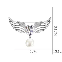 Broche luxueuse - ailes d'ange - coeur cristal - perle