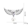 Broche luxueuse - ailes d'ange - coeur cristal - perle