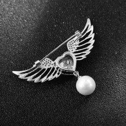 Broche luxueuse - ailes d'ange - coeur cristal - perle