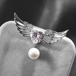 Broche luxueuse - ailes d'ange - coeur cristal - perle
