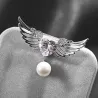 Broche luxueuse - ailes d'ange - coeur cristal - perle