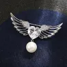 Broche luxueuse - ailes d'ange - coeur cristal - perle