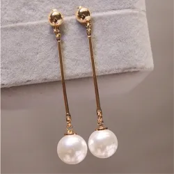 Long golden earrings with a pearlEarrings