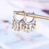 Petites boucles d'oreilles rondes argentées - poissons pendants