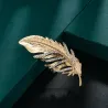 Broche plume dorée - avec cristaux