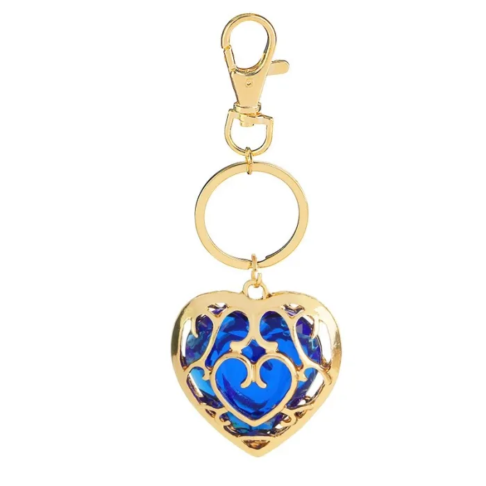 Coeur en cristal dans cage dorée - porte-clés