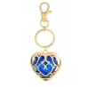 Coeur en cristal dans cage dorée - porte-clés