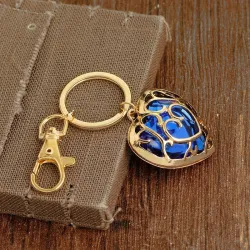 Coeur en cristal dans cage dorée - porte-clés