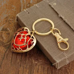 Coeur en cristal dans cage dorée - porte-clés