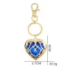 Coeur en cristal dans cage dorée - porte-clés