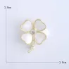 Broche trèfle à quatre feuilles - coquillage / cristal