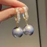 Boucles d'oreilles en cristal avec une perle