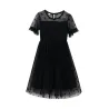 Élégante robe en mousseline noire à pois