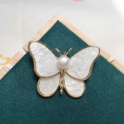 Papillon coquillage avec perle - broche