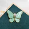 Papillon coquillage avec perle - broche