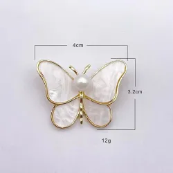 Papillon coquillage blanc - avec une perle - broche