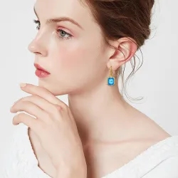 Boucles d'oreilles dorées avec topaze cristal bleu / strass