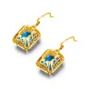 Boucles d'oreilles dorées avec topaze cristal bleu / strass
