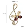 Note de musique avec papillon - broche