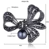 Broche fleur en cristal - avec perle noire