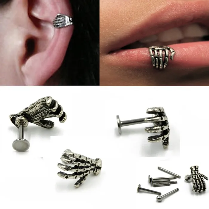 Body piercing with skull hand