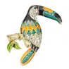 Broche élégante avec oiseau toucan cristallin